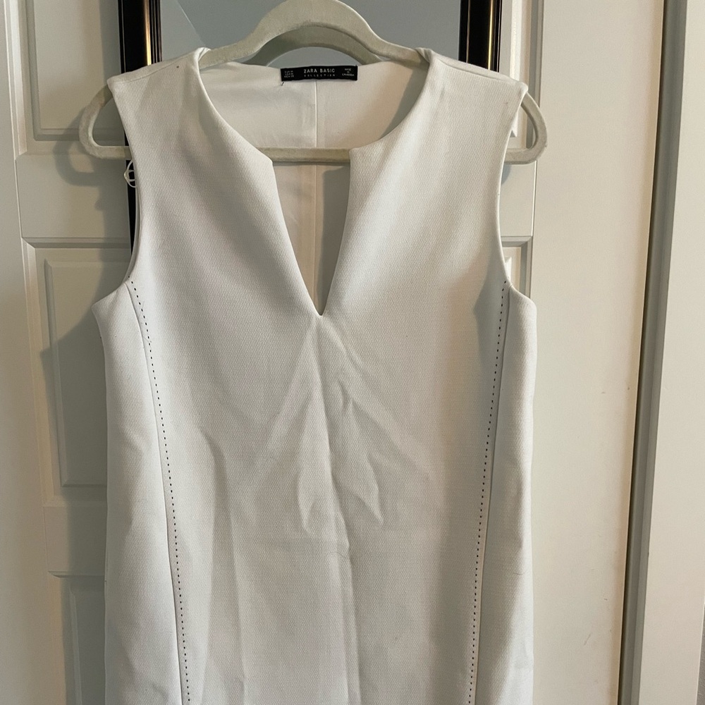 Classic white office dress with black side stitching. fully lined Size medium.